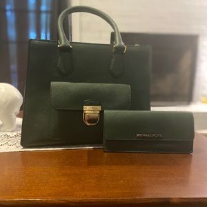 Green Michael Kors purse with a matching wallet.